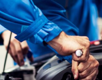 Certified mechanic performing automotive repair service